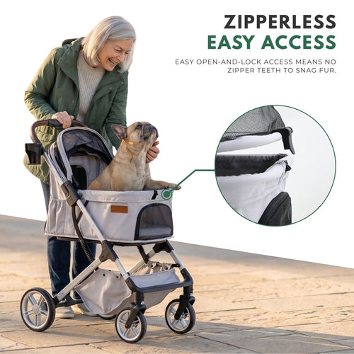 An older woman is pushing a light grey pet cart along the paved path. Inside the cart is a dog, and she is interacting with the dog. The cart features a lock mechanism without zippers.