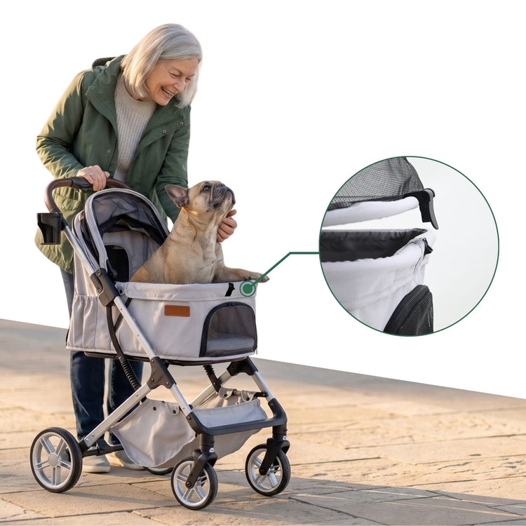 A woman is pushing a pet stroller with its canopy open, petting the French Bulldog inside.